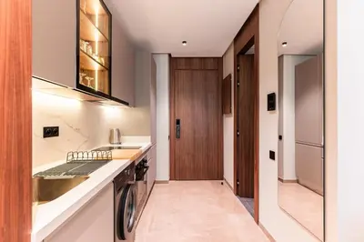 a kitchen with a sink and a dishwasher at Princesses Luxury Studio - Elegance & Light in Casablanca