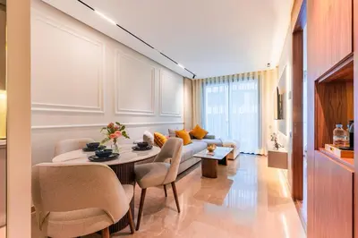 a living room with a couch and a table and chairs at Princesses Luxury Studio - Elegance & Light in Casablanca