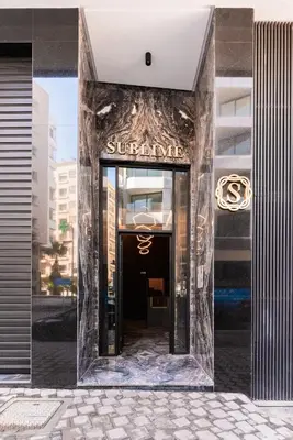 a entrance to a building with a sign on it at Princesses Luxury Studio - Elegance & Light in Casablanca
