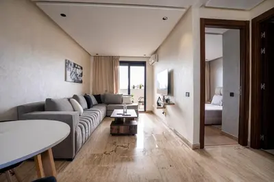 a living room with a couch and a bed at New 8th floor Terrace 5 min from train stations in Casablanca