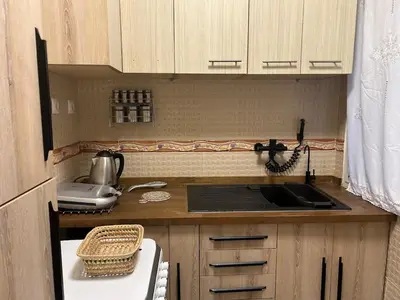 a small kitchen with a sink and a stove at Apartamento Temara Morroco in Temara