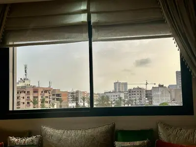 a large window with a view of a city at Twin Center View Apt in Maarif in Maarif