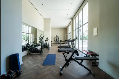 a gym with several treadmills and exercise bikes at Prestigieux appartement 3 chambre plein cœur CFC in Casablanca