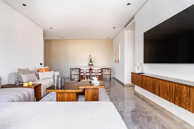 a living room with a large flat screen tv at Prestigieux appartement 3 chambre plein cœur CFC in Casablanca