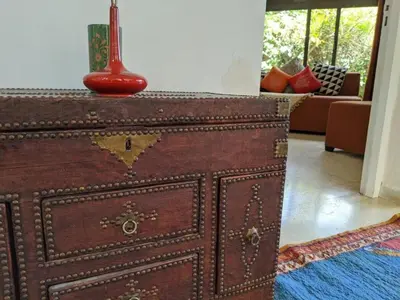 a wooden dresser with a red object on top of it at Cosy and Spacious 4BR villa 5 min to Hay Riad in Temara