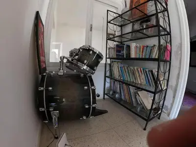 a room with a drum and a shelf with books at Cosy and Spacious 4BR villa 5 min to Hay Riad in Temara