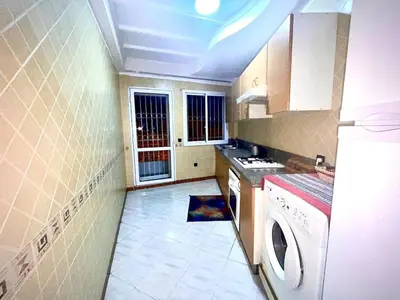 a kitchen with a washer and dryer in it at Modern Central Apartment in Casablanca in Casablanca