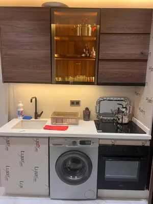 a kitchen with a washing machine and a sink at Proche chekh khalifa KLIVING Studio in Casablanca