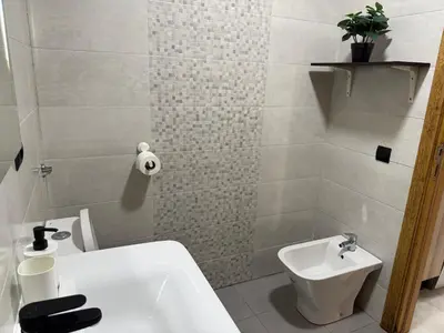 a bathroom with a white sink and a toilet at Studio Stadium morocco for family in Mohammedia