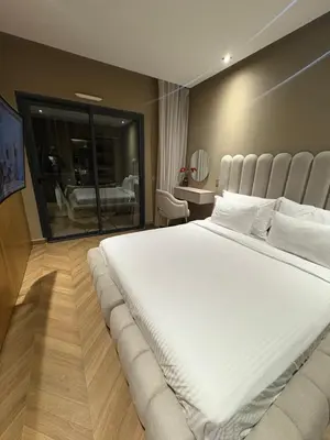 a bedroom with a large white bed in a room at Appartement haut standing Casablanca in Casablanca