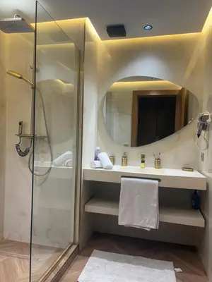 a bathroom with a shower and a sink and a mirror at Appartement haut standing Casablanca in Casablanca