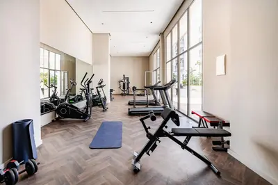 a gym with several treadmills and elliptical machines at Luxueux appartement 3 chambre en plein cœur CFC NEXT HOUSE 3 in Casablanca