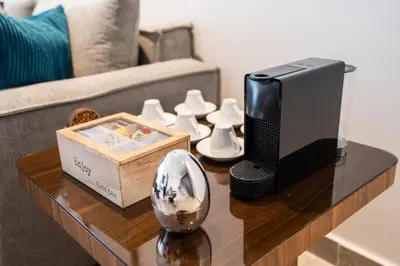 a television on a coffee table in a living room at Luxueux appartement 3 chambre en plein cœur CFC NEXT HOUSE 3 in Casablanca