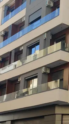 an apartment building with balconies on the side of it at Studio Maarif 5 minutes from Mohamed V studium in Casablanca