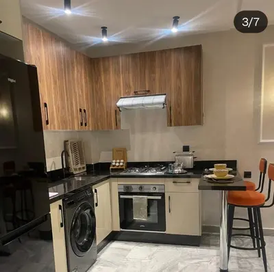 a kitchen with a stove and a dishwasher at Studio Maarif 5 minutes from Mohamed V studium in Casablanca