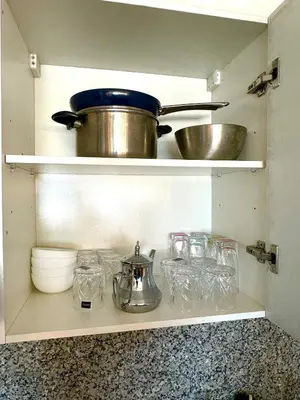 a kitchen shelf with a pot and other items on it at Pause cosy moderne in Casablanca