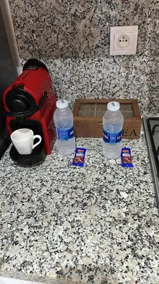 two bottles of water sitting on top of a counter at Pause cosy moderne in Casablanca