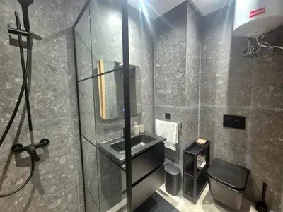 a bathroom with a sink and a mirror at VIVASTAY Casablanca - Metropole Bd Abdelmoumen in Casablanca