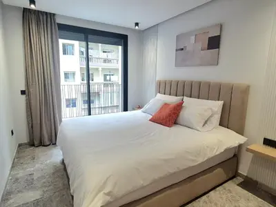 a bedroom with a large white bed with a window at VIVASTAY Casablanca - Metropole Bd Abdelmoumen in Casablanca