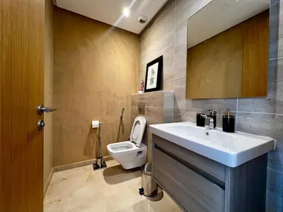 a bathroom with a sink and a toilet at Luxurious 1BR Orangeraie - Terrace & Pool in Oulad Akkou