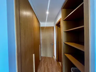 a room with wooden shelves and a hallway at Luxurious 1BR Orangeraie - Terrace & Pool in Oulad Akkou