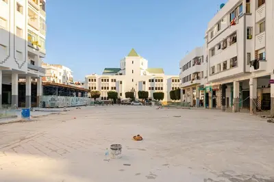an empty street in a city with buildings at Appartement spacieux Océan Rabat in Rabat