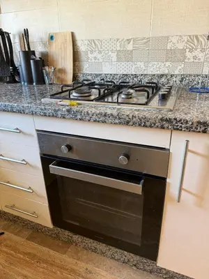a kitchen with a stove and a counter top at Appartement spacieux Océan Rabat in Rabat