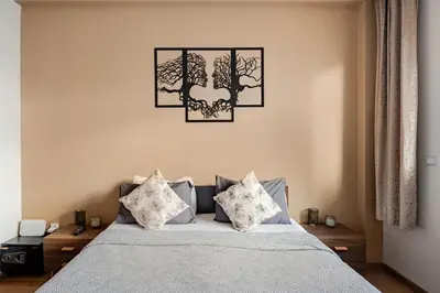 a bedroom with a bed with two pillows on it at Appartement spacieux Océan Rabat in Rabat