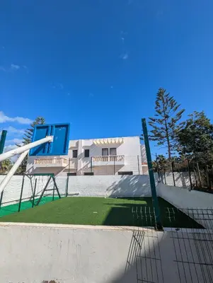 a skate park with a bench and a skate ramp at Maison Lalla najat in Sidi Rahal