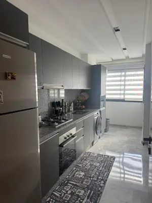 a kitchen with stainless steel appliances and a window at Anfa Ivory Hassan II in Casablanca