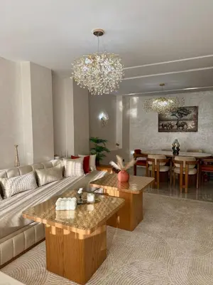 a living room with a couch and a table at Anfa Ivory Hassan II in Casablanca