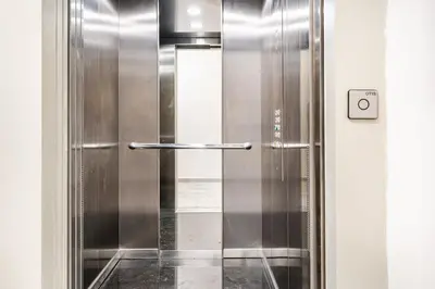 a shower with a metal door in a bathroom at CFC new Appartement Central Anfa Park roof top free parking in Casablanca
