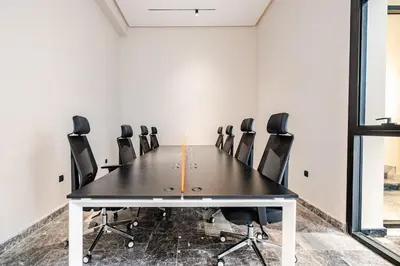 a conference room with a table and chairs at CFC new Appartement Central Anfa Park roof top free parking in Casablanca