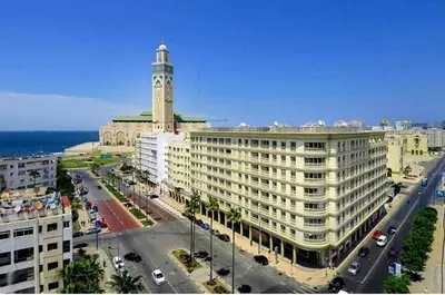 a large building with a clock tower on top of it at Casablanca House hassan2 in Casablanca