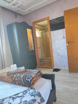 a bedroom with a bed and a mirror at Casablanca House hassan2 in Casablanca