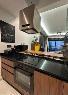 a kitchen with a stove and a counter top at A 1 pas de Zara Studio Centrale et Design in Casablanca