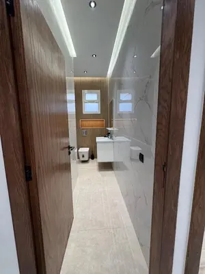 a bathroom with a toilet and a sink at Luxury apartment in Rabat