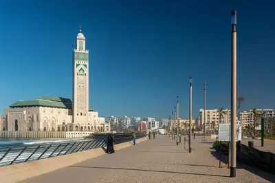 a large building with a clock tower in a city at Casa Bourgogne 2-Bedroom apart, Guarded community in Casablanca