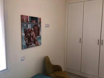 a room with a picture of a tiger on the wall at AFCON near rabat complex de football in Bouznika