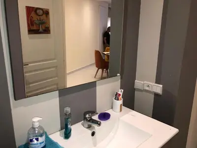 a bathroom with a sink and a mirror at AFCON near rabat complex de football in Bouznika