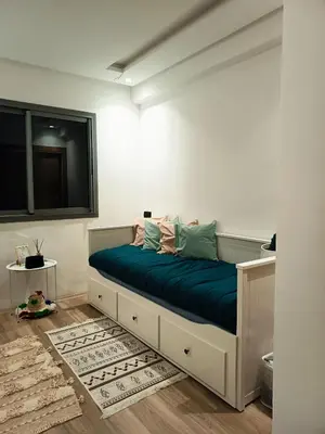 a bedroom with a bed with a blue blanket at Nouaceur Suite avec Piscine Casa Aéroport AirNest in Nouaseur