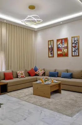 a living room with a couch and a coffee table at Cozy Modern Studio Near Zenâta Beach in Casablanca