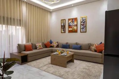 a living room with a couch and a coffee table at Cozy Modern Studio Near Zenâta Beach in Casablanca