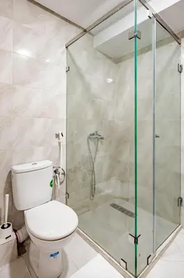 a bathroom with a toilet and a shower at Agdal Train Station Modern&Stylish Apartments in Rabat
