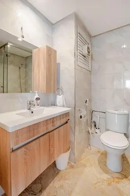 a bathroom with a sink and a toilet and a shower at Agdal Train Station Modern&Stylish Apartments in Rabat