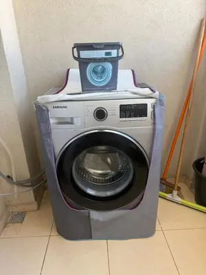 a washing machine with a box on top of it at Lumineux cosy appartement - océan Rabat in Rabat
