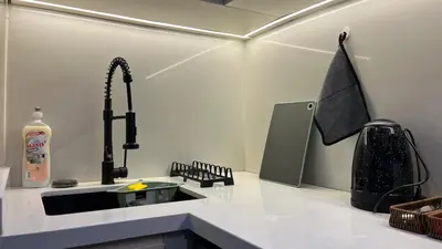 a kitchen counter with a sink and a sink at Luxurious studio with unobstructed view in Casablanca