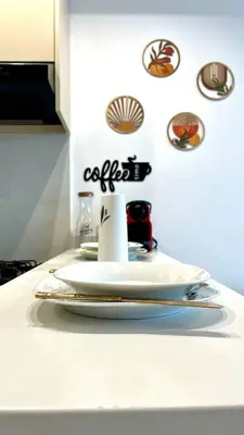 a plate on a kitchen counter with plates on it at Luxurious studio with unobstructed view in Casablanca