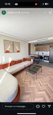 a living room with a couch and a table at Studio neuf - haut standing in Casablanca