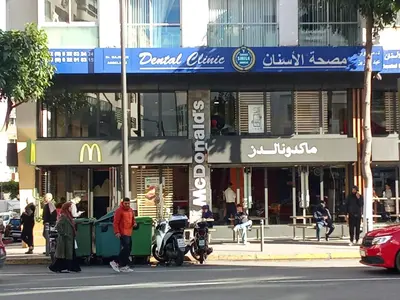 a sign for a mcdonalds restaurant on a city street at A Pleasant escape In Morocco in Casablanca